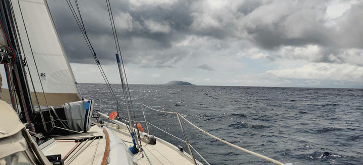 cloudy sailing in sight of the island