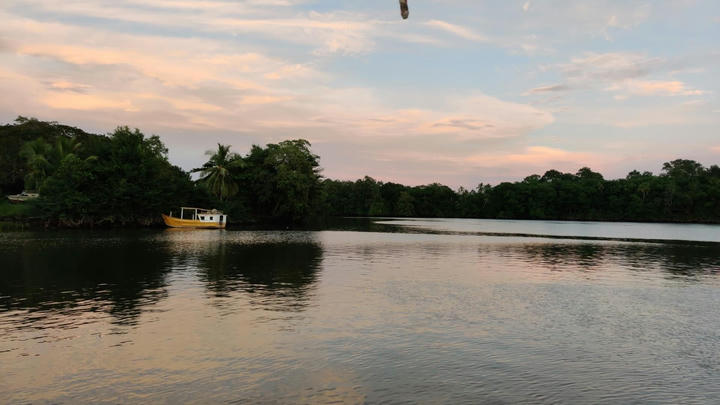 Yellow boat in the sunset